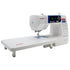 angled image of the Janome 3160QOV Quilts of Valor Sewing and Quilting Machine with table attached