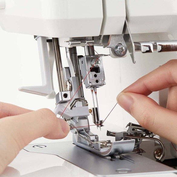 Juki MO-2800 Overlock Serger view of needle being manully threaded