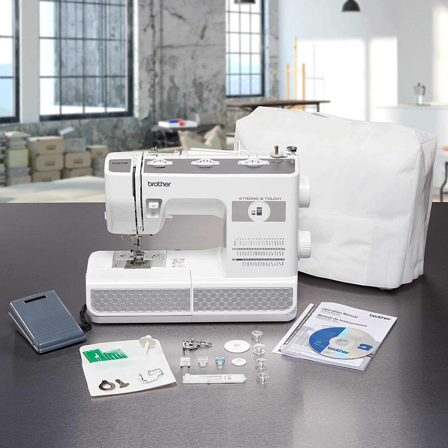 image of the Brother ST531HD Sewing Machine and included accessories on a table