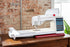Husqarna Viking Designer Ruby 90 Sewing and Embroidery Machine on a table