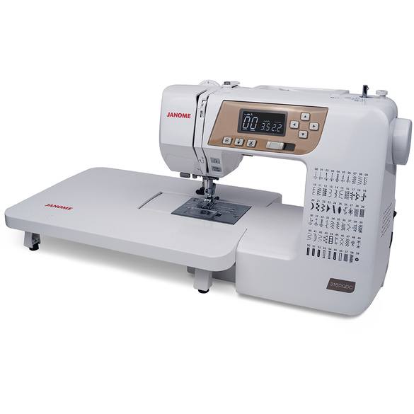 image of the Janome 3160QDC-T Computer Sewing Machine with table attached