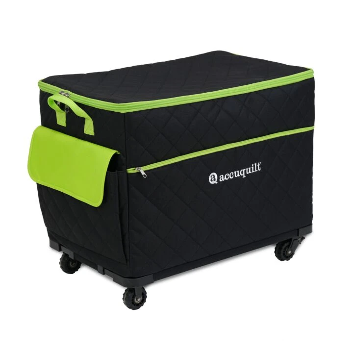 A black quilted rolling storage bin with bright lime green accents, including zippers, handles, and a side pocket, featuring the 'accuquilt' logo on the front.