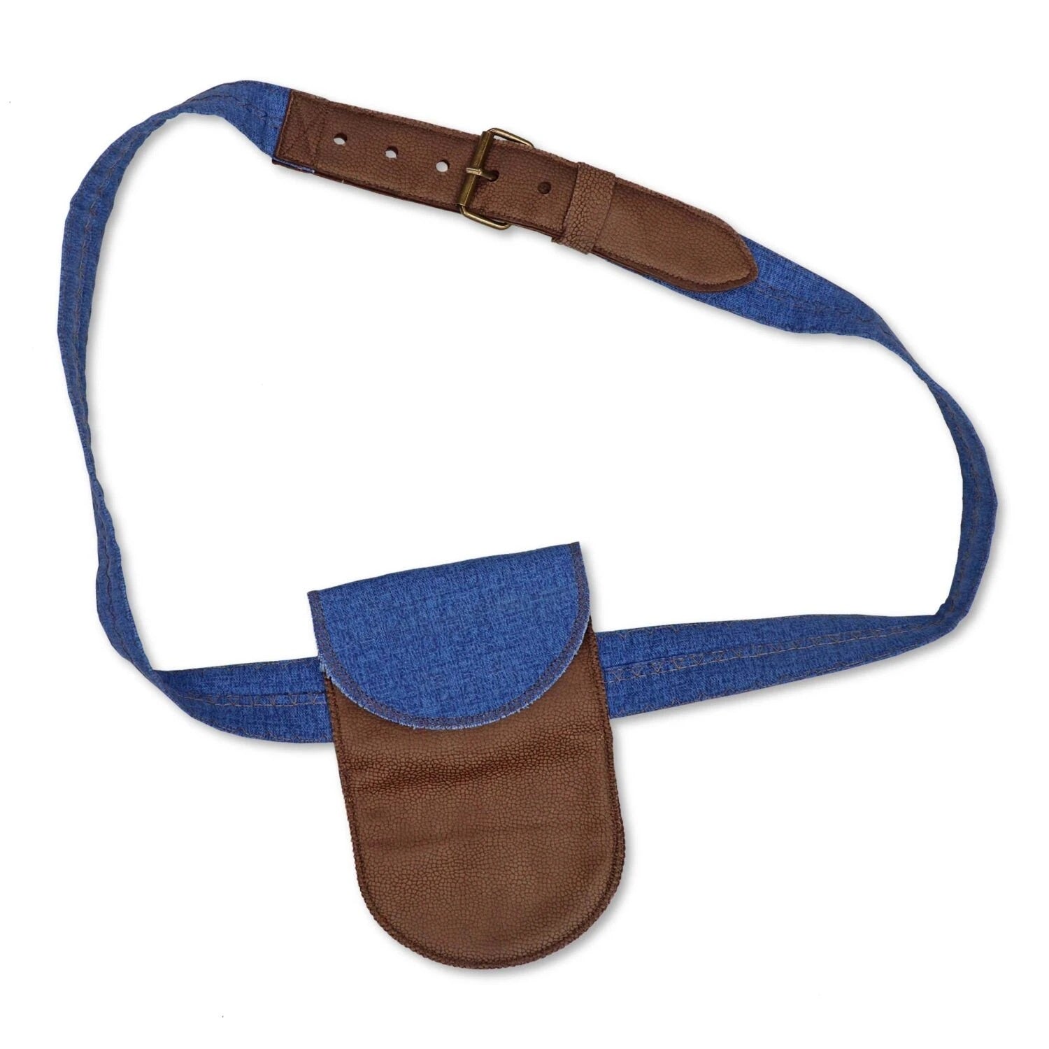 A blue denim crossbody bag with brown leather trim, a matching flap pocket, and an adjustable leather strap with a brass buckle, shown on a plain white background.