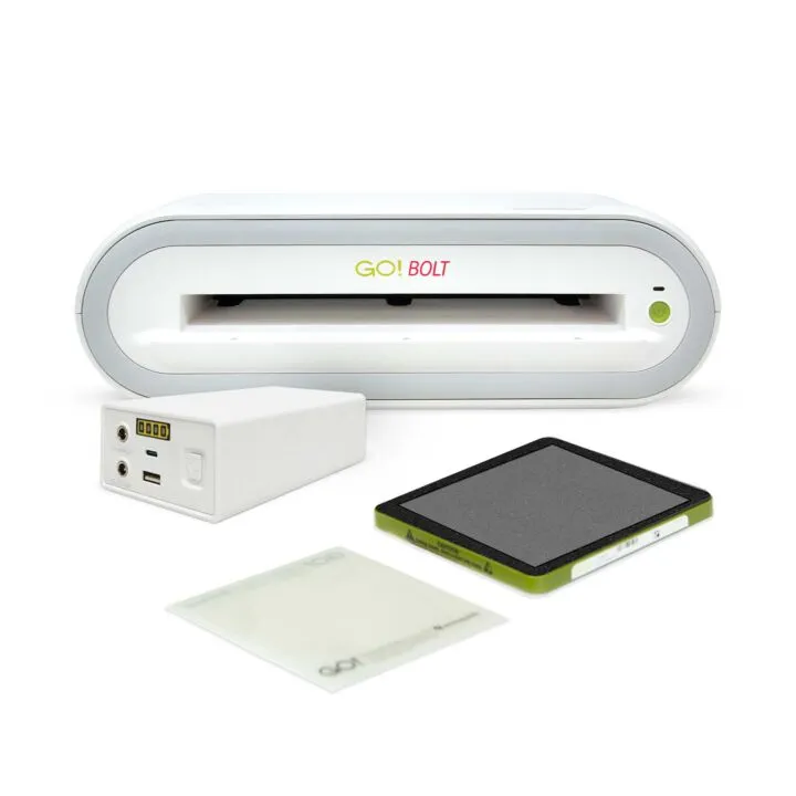 GO! BOLT device with power bank, cutting mat, and cutting die on a white background