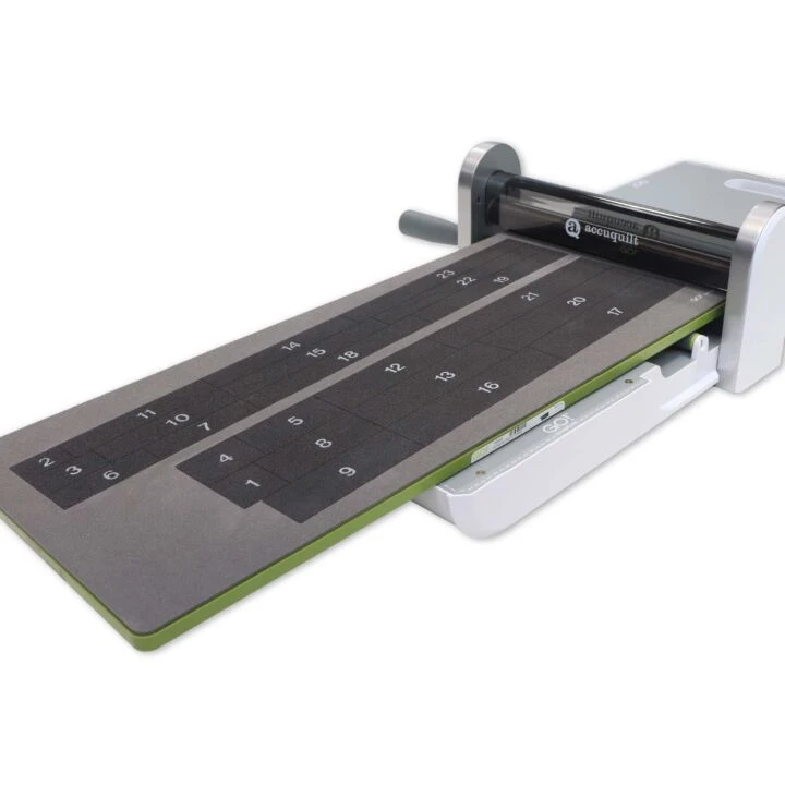 AccuQuilt fabric cutter with a white background
