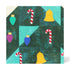 A square quilted fabric panel with a geometric pattern of dark green triangles, light teal sections, and festive holiday motifs including red-and-white striped candy canes, yellow bells, and colorful ornament shapes in teal, purple, and blue.