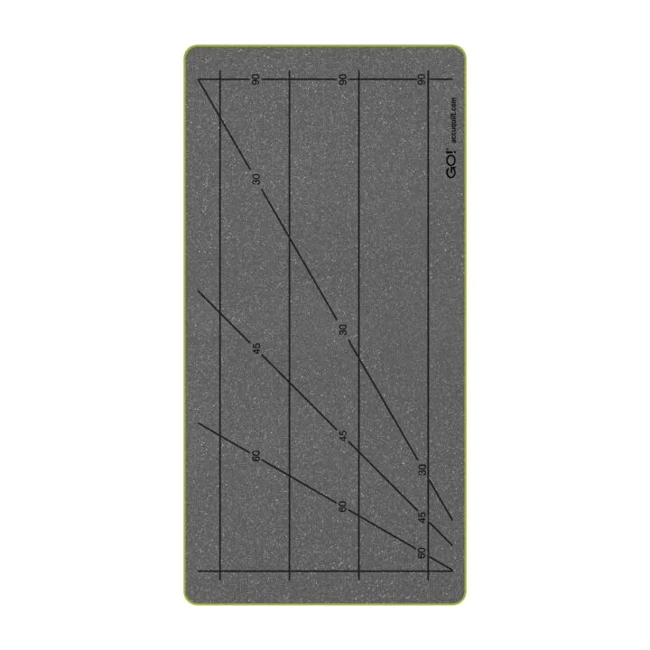 Gray cutting mat with grid lines and measurements on a white background