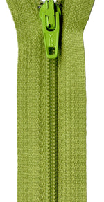 A close-up of a textured olive green zipper with a bright lime green pull tab, set against a plain white background.