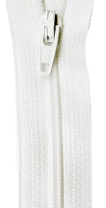 Close-up of a white textured fabric with a zipper on a white background