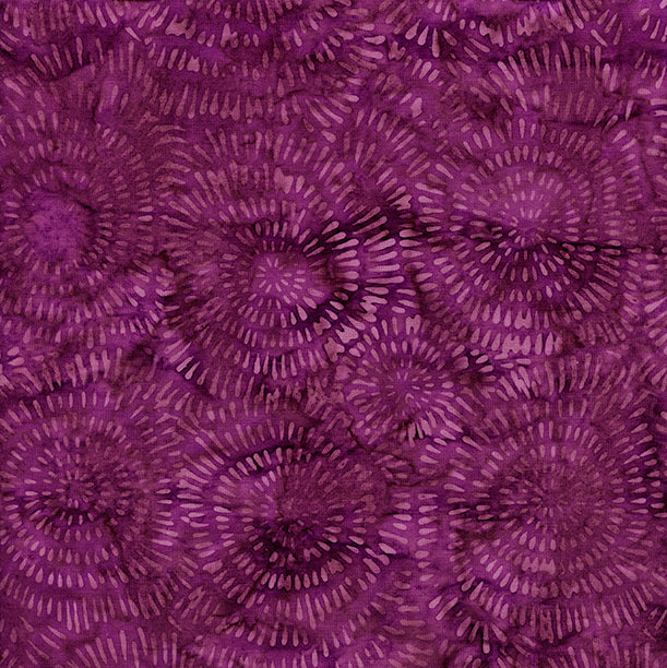 Close-up of a purple fabric with circular pattern
