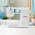 White Bernina sewing machine on a table with a blurred background