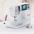 A white BERNINA sewing machine with a digital screen and control knobs, shown on a clean white surface with spools of thread nearby.