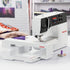 Bernina sewing machine on a white surface with a blurred background