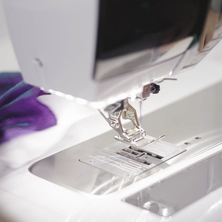 Close-up of a sewing machine needle and foot