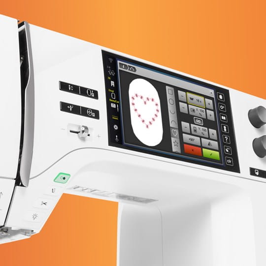 Sewing machine with digital display and control panel on an orange background