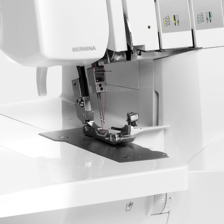 Bernina sewing machine with needle and presser foot on a white background