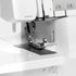 Bernina sewing machine with needle and presser foot on a white background