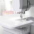 Close-up of a sewing machine with a blurred background