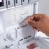 Hand interacting with an air threading serger on a white background