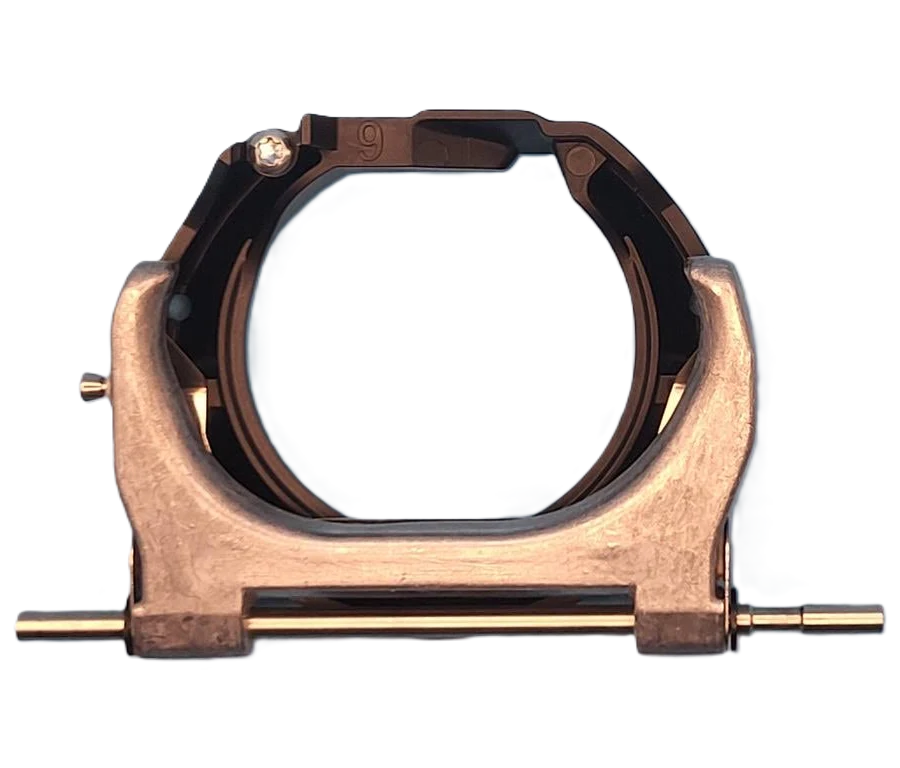 A bronze-colored metal clamp or bracket with a circular opening, featuring a horizontal rod with two pins and a small screw adjustment on the left, set against a plain white background.