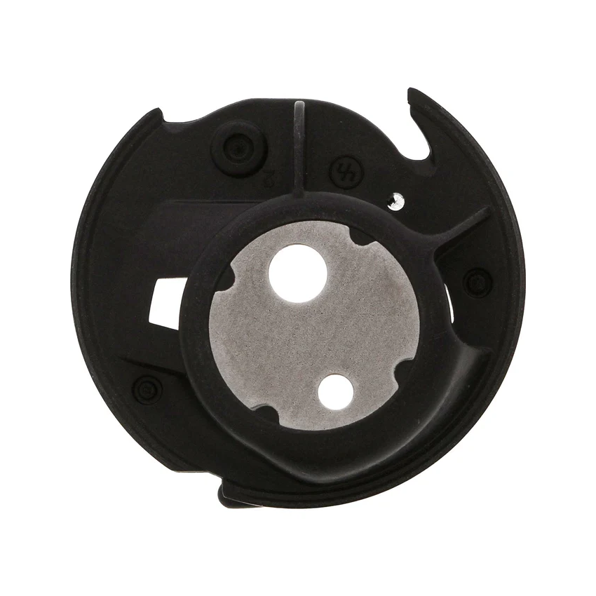 A black circular bobbin case featuring a silver metallic center plate with circular cutouts, shown on a plain white background.