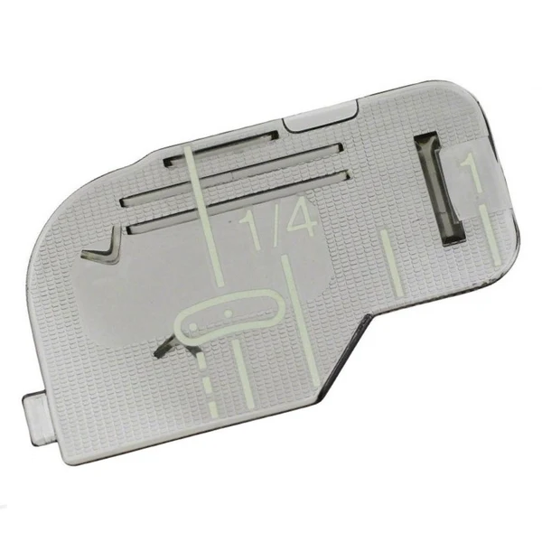 A silver metal sewing machine needle plate cover with printed guide markings and size indicators, shown on a plain white background.