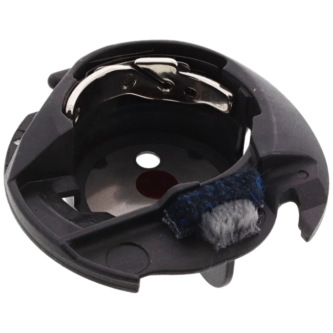 Black plastic replacement part for a sewing machine, featuring a metal hook, a small dark red circular detail, and a blue and white textured brush on the side.