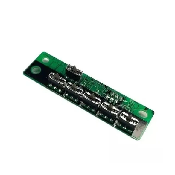 A green printed circuit board module with multiple silver metal contacts and small electronic components, photographed on a plain white background.