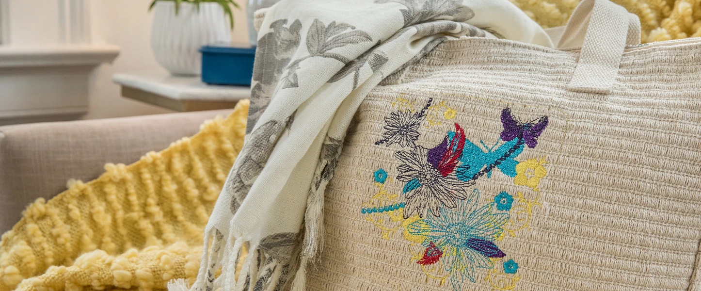 Textile item with floral embroidery on a couch