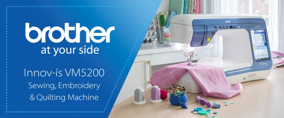 Brother Innov-is VM5200 sewing, embroidery, and quilting machine on a table with accessories.