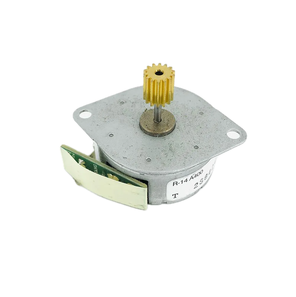 A small brushed DC motor with a square silver metal housing, a brass-colored output shaft with a gear, and a green circuit board attached on the side, shown on a white background.