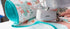 Sewing machine with a floral fabric roll on a white background