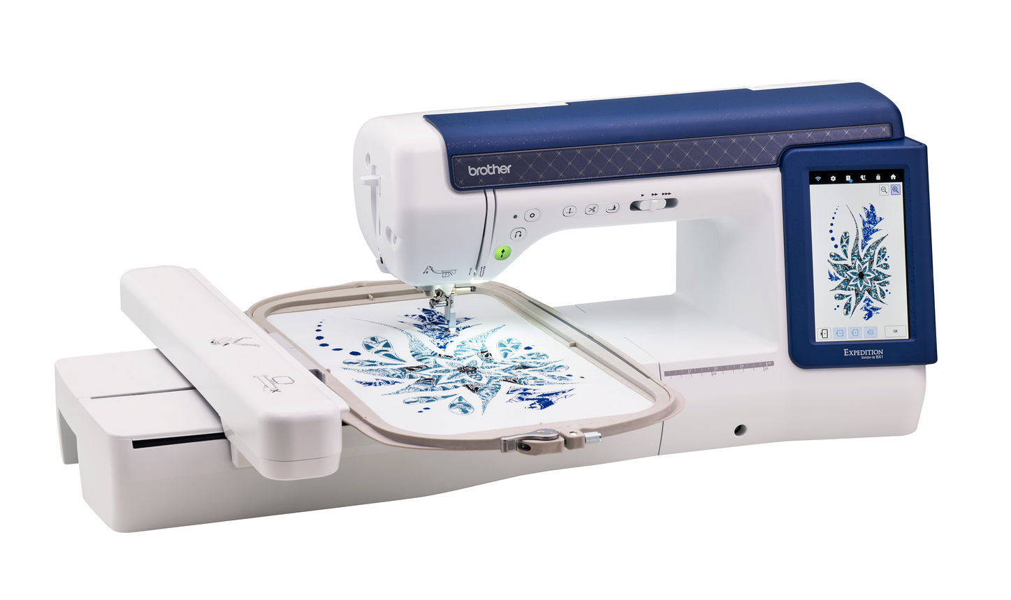 A Brother embroidery machine with a digital touchscreen display, shown with an embroidery hoop containing a blue snowflake design on white fabric, against a solid white background.