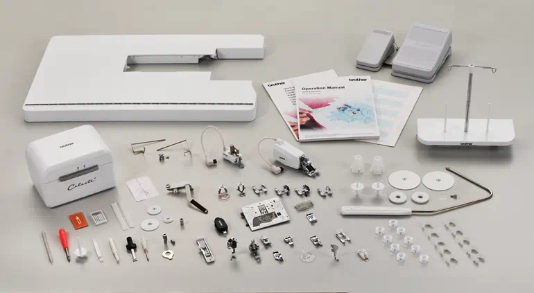 Embroidery machine accessories on a gray background
