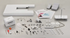 Embroidery machine accessories on a gray background