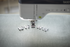 Sewing machine with various presser feet on a fabric background