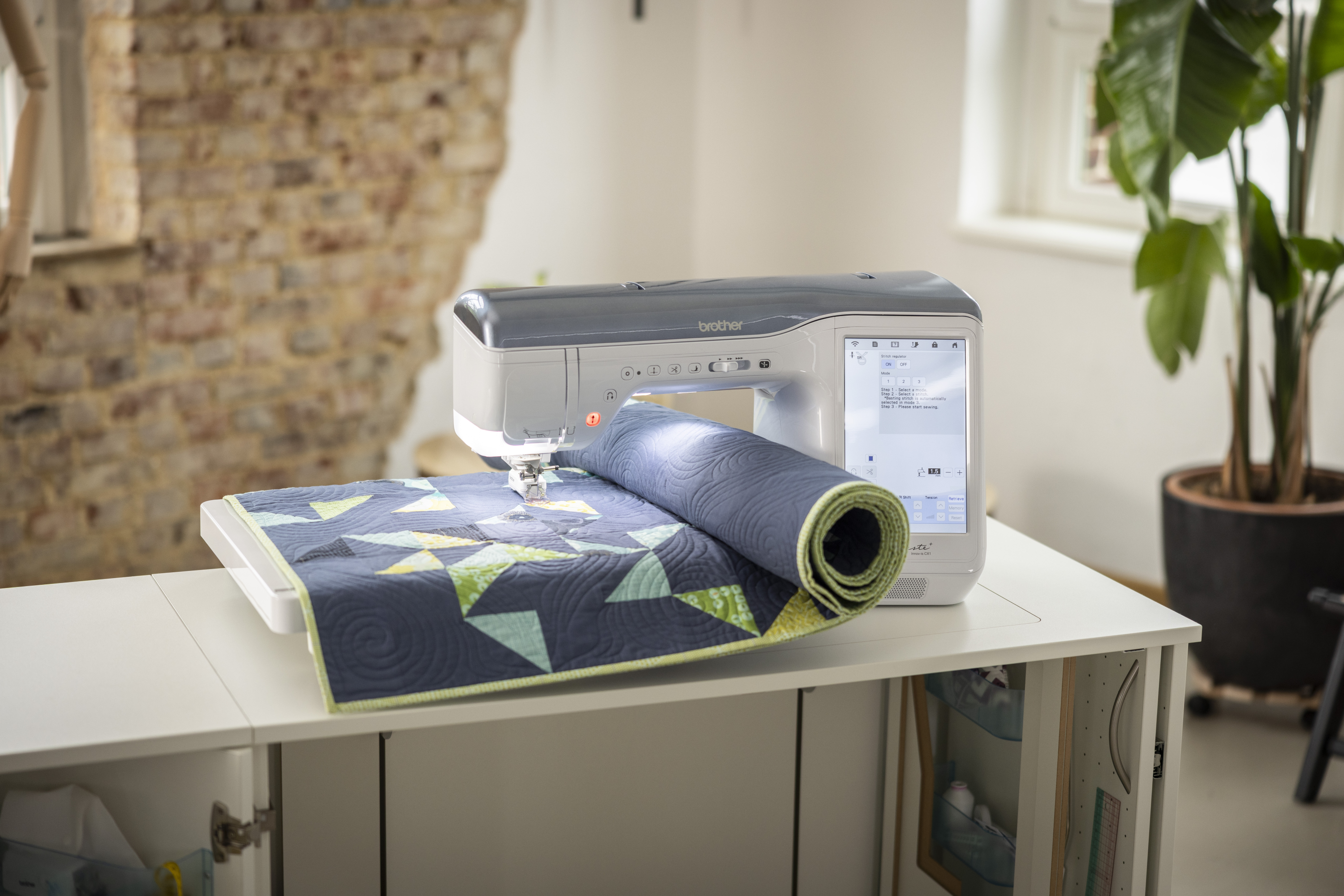 Sewing machine with a fabric roll on a table in a home setting