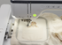 Embroidery machine stitching a design on fabric