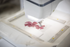 Embroidery machine with a floral design on a white background