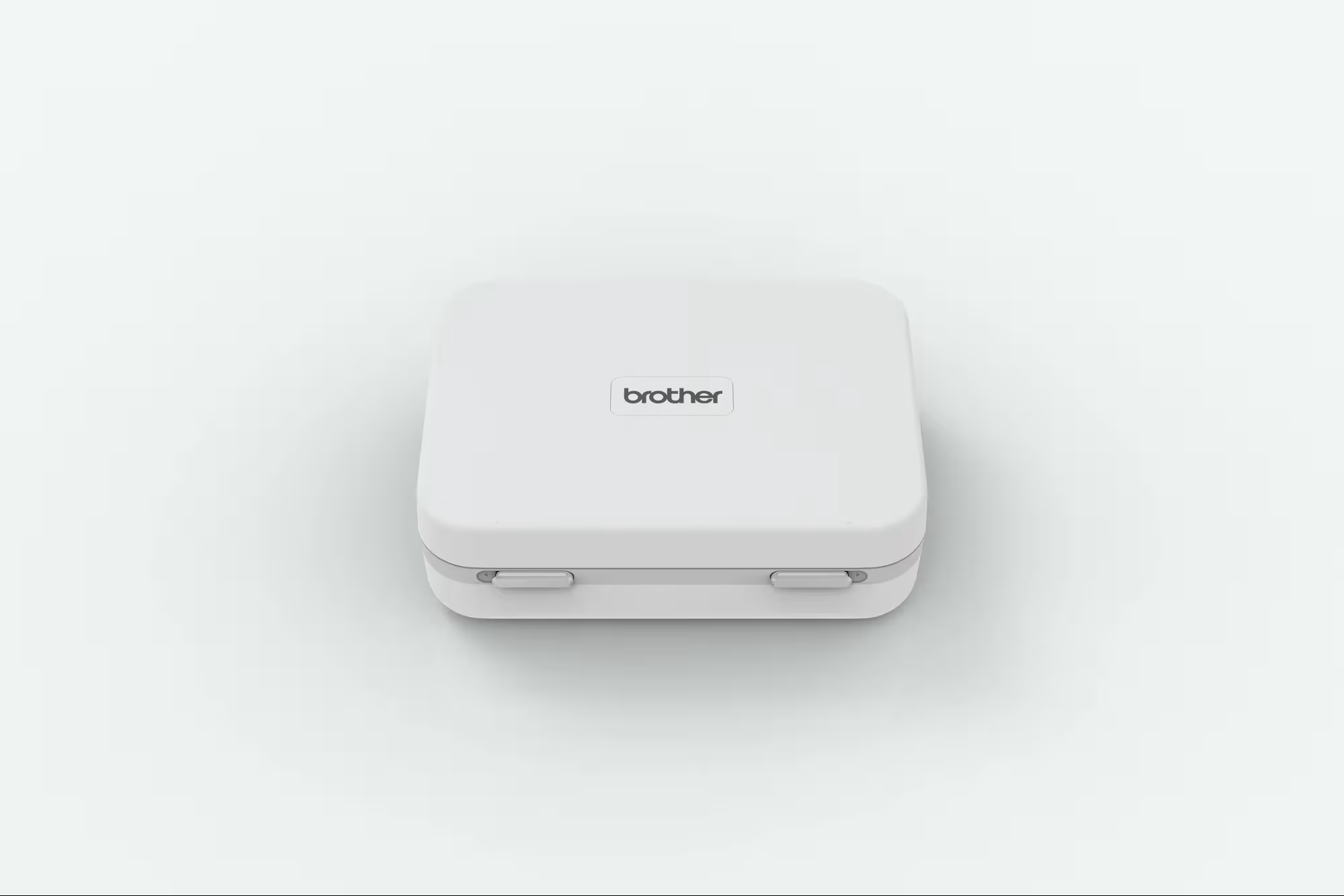 A Brother compact, square, white stitch regulator case with rounded corners and a small black 'brother' logo on top, shown on a clean white background.