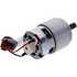 A small cylindrical electric motor with a silver metal body, black shaft, and attached red and black wires with a white connector, shown on a plain white background.