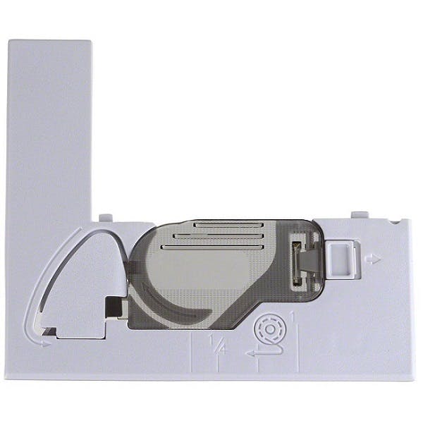 Close-up of a white needle plate component with a black and gray bobbin cover on a white background