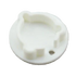 A small white plastic circular component with a molded irregular shape and a small hole near the lower right edge, shown on a plain white background.