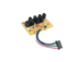 A small electronic circuit board with three black terminal blocks and a multi-colored wire connector, shown on a plain white background.