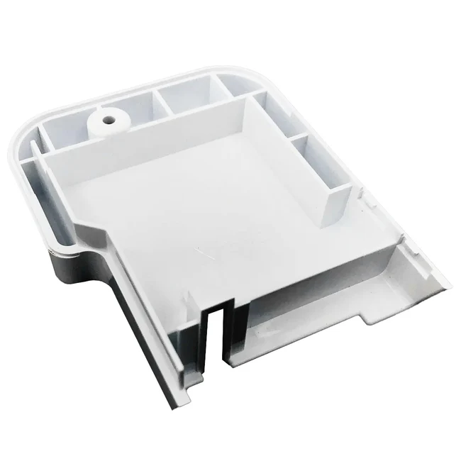 White plastic component with multiple compartments on a white background