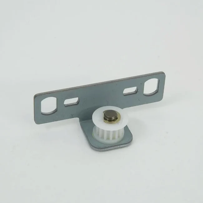 A small metal hardware component with a flat gray bracket, a white plastic gear, and a gold-toned central pin, photographed on a clean white background.