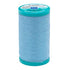 Spool of light blue thread with a green lid on a white background