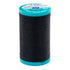 Spool of black thread with teal cap on a white background