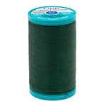 Spool of green thread with a Coats label on a white background