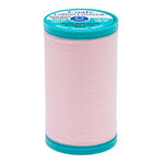 Spool of pink thread with a blue label on a white background